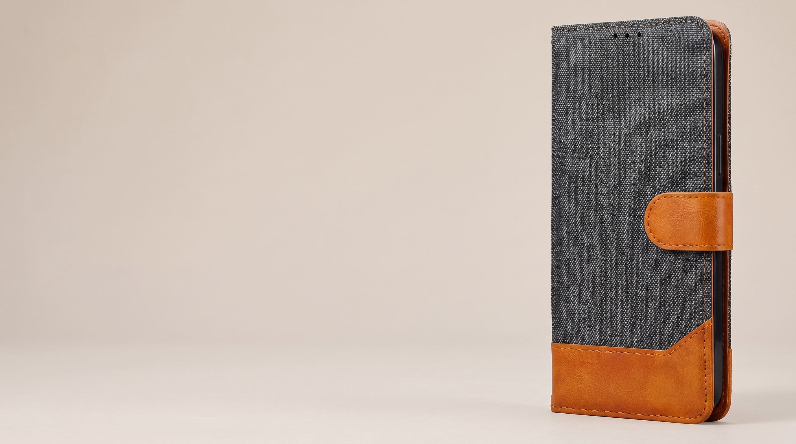 Graphite Grey denim wallet flip cover, closed, showing the tan vegan-leather bottom trim and side magnetic strap