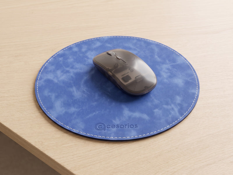 Flat round mouse pad with a white stitched edge, lying completely flat