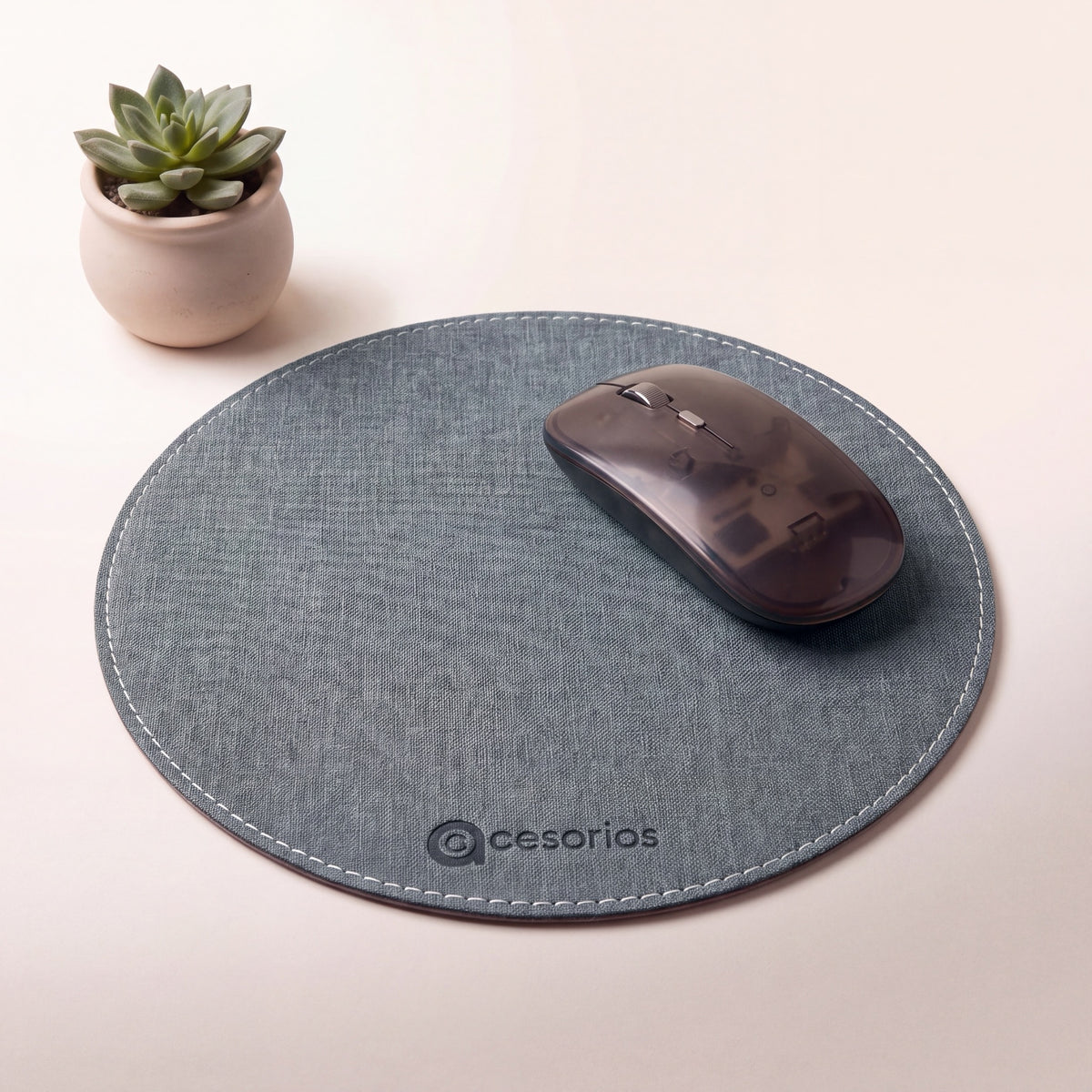 Ash Grey round chambray fabric mouse pad 23 cm - on a warm studio background with a modern mouse