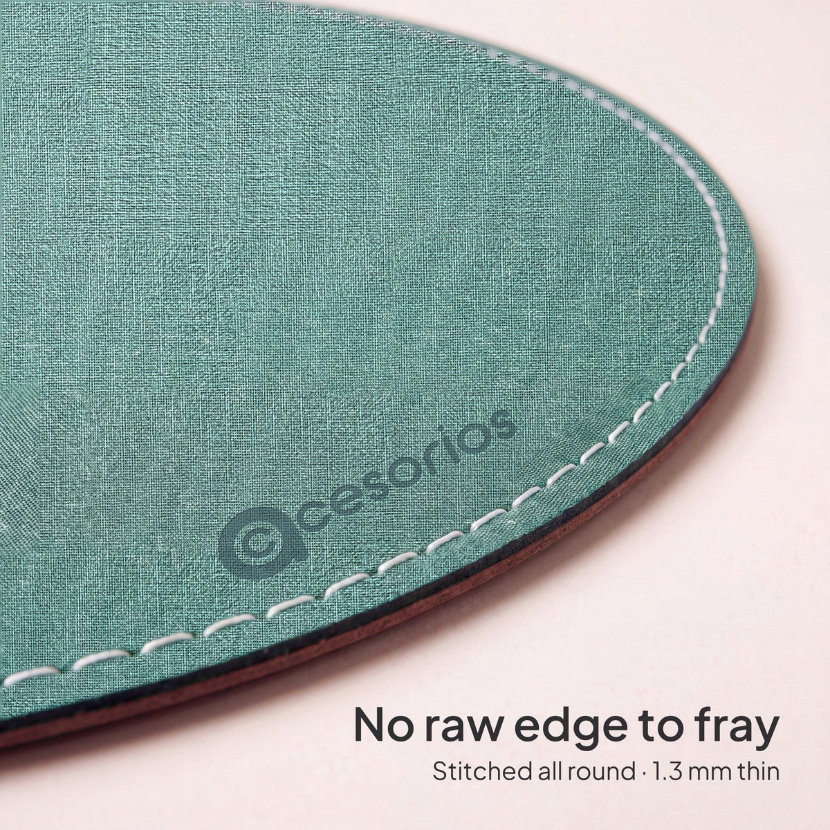 Sage Green round chambray fabric mouse pad 23 cm - close-up of the white stitched edge, 1.3 mm thin