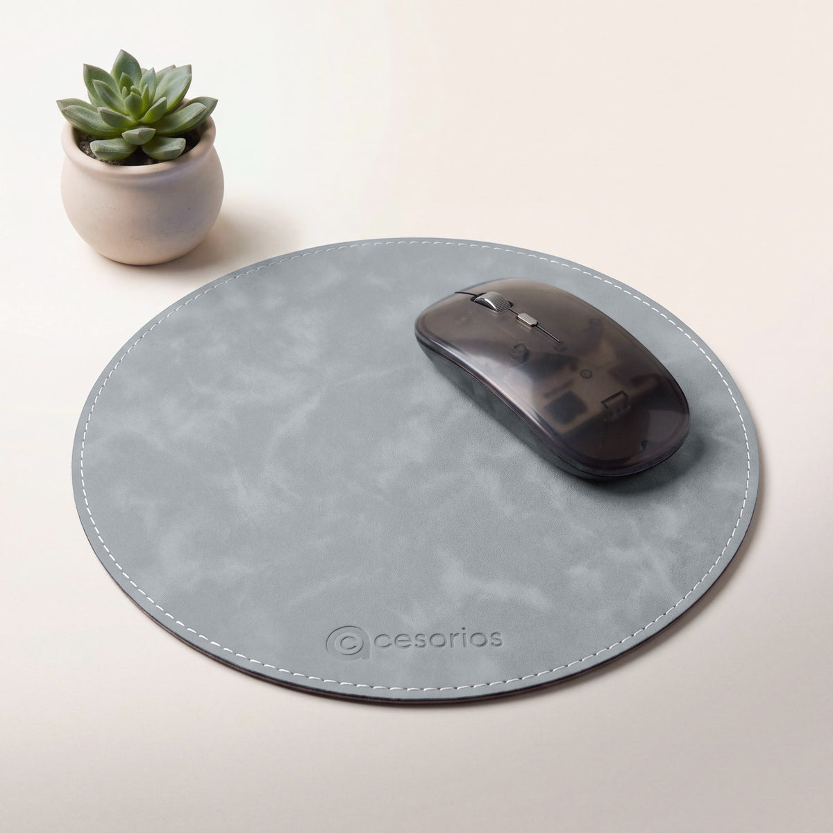 Stone Grey round vegan leather mouse pad 23 cm - on a warm studio background with a modern mouse