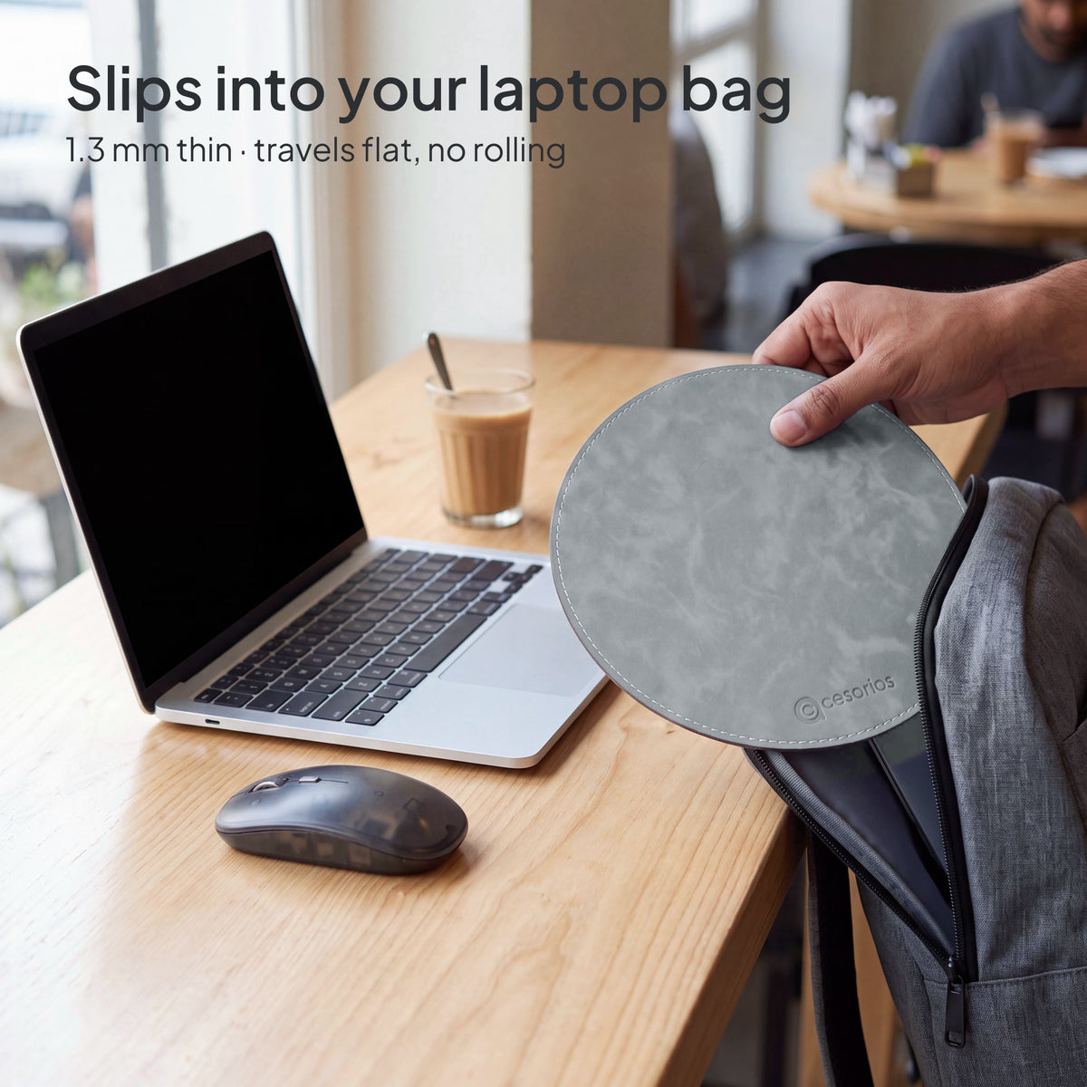 Stone Grey round vegan leather mouse pad 23 cm - sliding flat out of a laptop bag